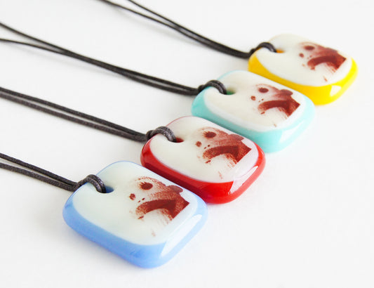 Limited batch of colourful glass sock monkey necklaces
