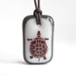 Turtle necklace in charcoal grey and white. 