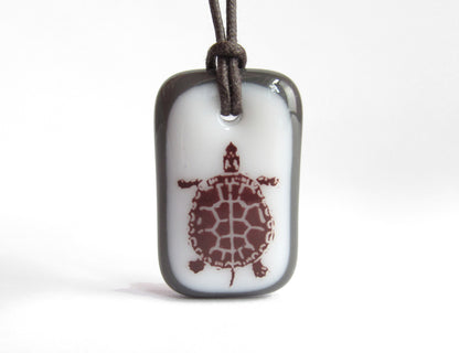 Turtle necklace in charcoal grey and white. 