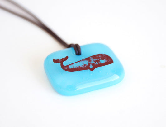 Whale necklace in aquamarine glass. 