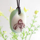 Wildflower necklace in pale green. 